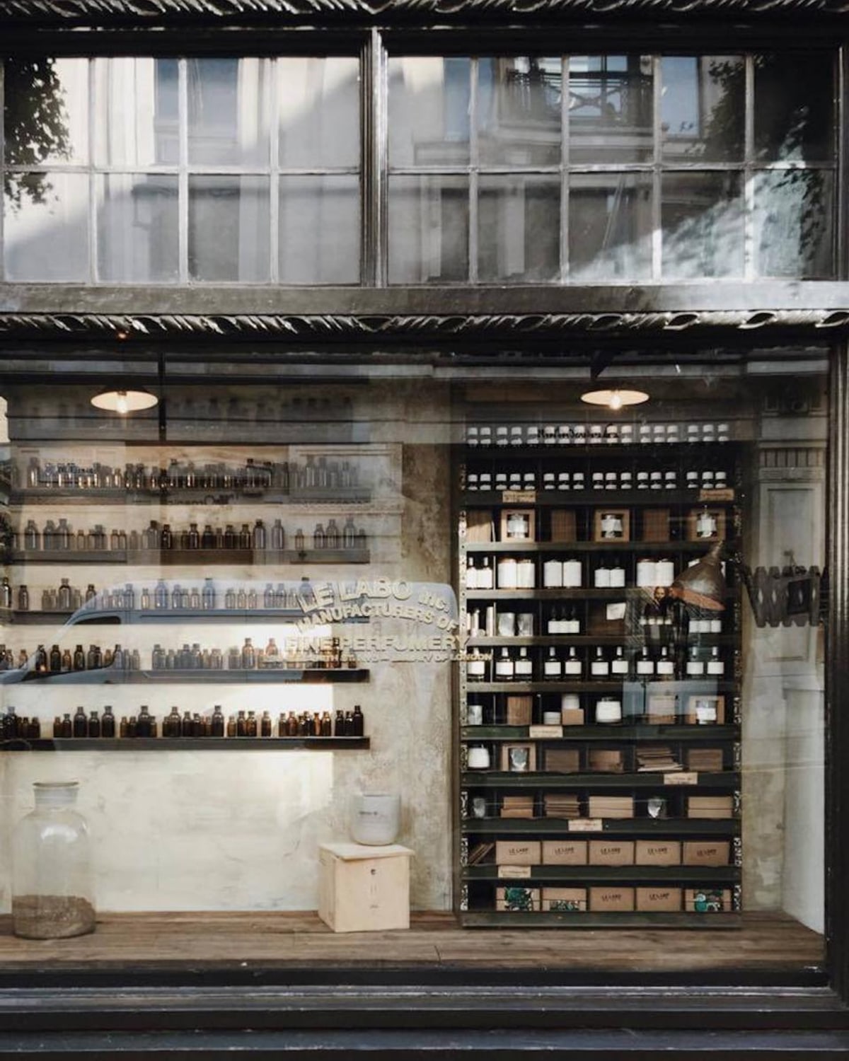 Travel perfume bottles arranged with a suitcase